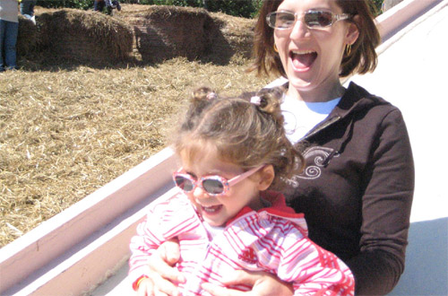 woman and child on a slide